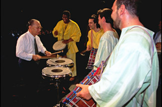 Ikeda interacting with participants at a youth culture festival held in Milan, Italy, 1994