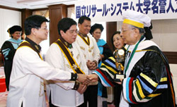 Mr. Ikeda (right) greets Knights of Rizal officers