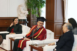 Dr. ElBaradei (center) wearing cap and gown following honorary doctorate conferral from Soka University