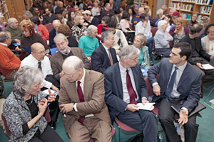 Audience members and panelists engage in discussions