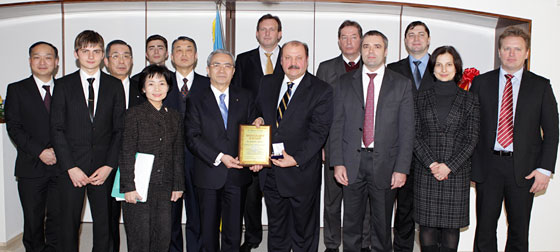 certificate and medal to Soka Gakkai President Minoru Harada