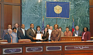 Atlanta City Council Member Ceasar C. Mitchell (foreground, 4th from left) presents a certificate of commendation to an SGI-USA youth representative (March 3, 2008)